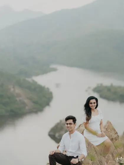 A serene portrait set against the breathtaking backdrop of Udaipur's lakes and Aravalli hills. We position our couples to capture both their connection and the majestic, painterly landscape that makes the city so iconic.