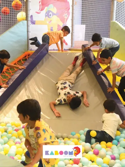 The slide is always a hub of activity! Kids love climbing up and sliding down into the soft landing of our colorful ball pit.