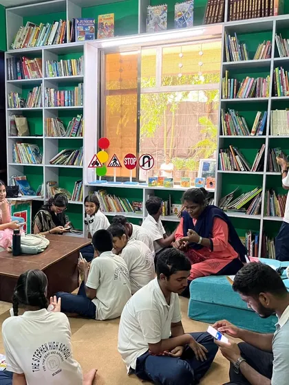 A wide shot of our research assistants working with children in the East Meets West library. This initiative helps us scientifically validate the healing power of stories and continuously improve our approach.