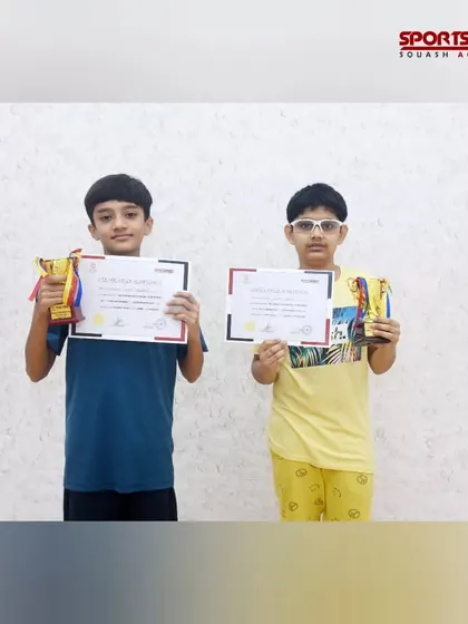 The proud winners of our junior squash tournament, holding their trophies and certificates. We celebrate every achievement, big or small.