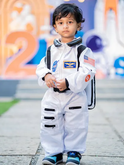 A portrait of the little astronaut, looking ready for his mission. The detailed costume adds an amazing touch to the themed experience.