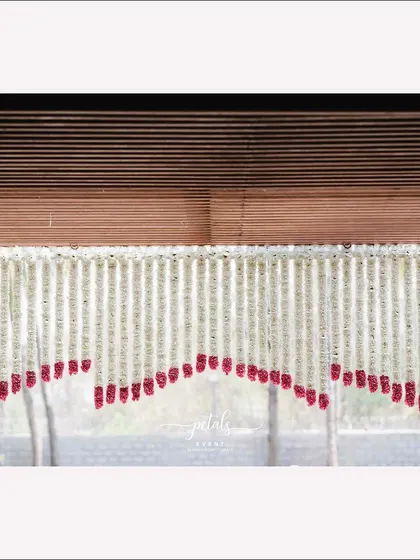 A close-up of the hanging floral decoration at the entrance, a beautiful and traditional way to welcome guests.