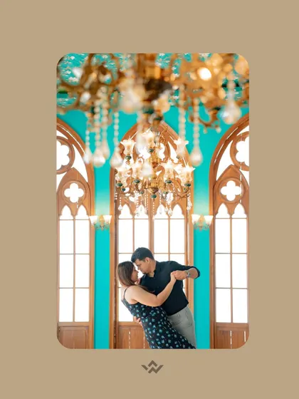 A romantic dance under a grand chandelier in a beautifully designed modern space. This shot combines elegance, romance, and contemporary architectural style.