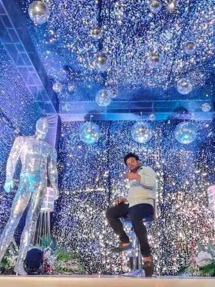 Another view of the modern sangeet stage, showing the ceiling covered in disco balls and the all-over glitter effect.