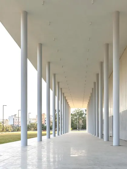 The TSSP Convention Center in its pure, unadorned state. The grand colonnade and polished concrete floors create a dignified and flexible public hall, a testament to the power of minimalist design.