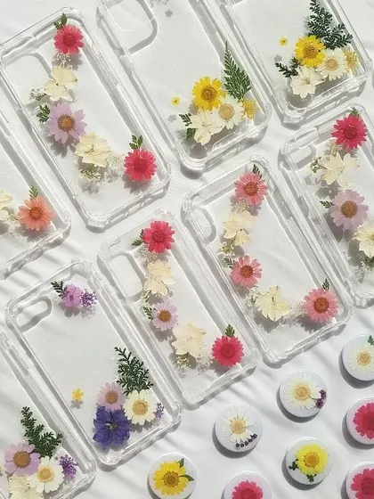 Your phone case can be a piece of art! I love creating these custom resin phone cases, embedding real dried and pressed flowers to make each one unique. This collection shows just a few of the floral designs I've made.