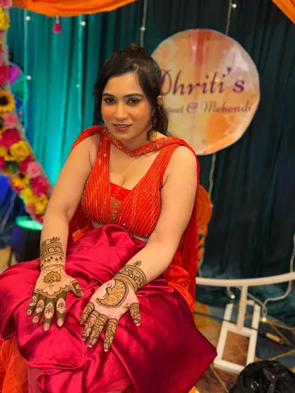 Another shot of this lovely bride, showing her intricate peacock palm designs.