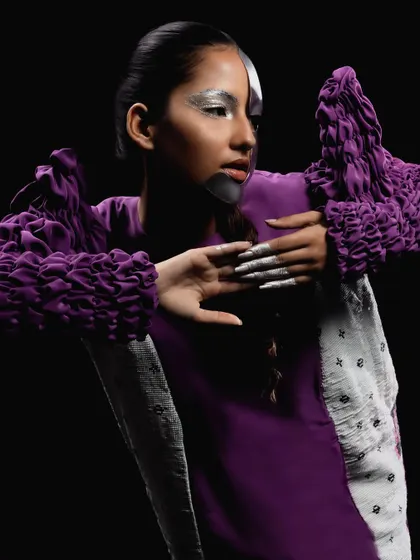 Another look from the "Metaverse" shoot, this time with a half-silver, half-natural face, creating a striking dual-identity concept.