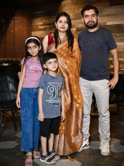 A posed portrait of a family of four. I take the time to arrange formal group shots that you can frame and cherish for years.
