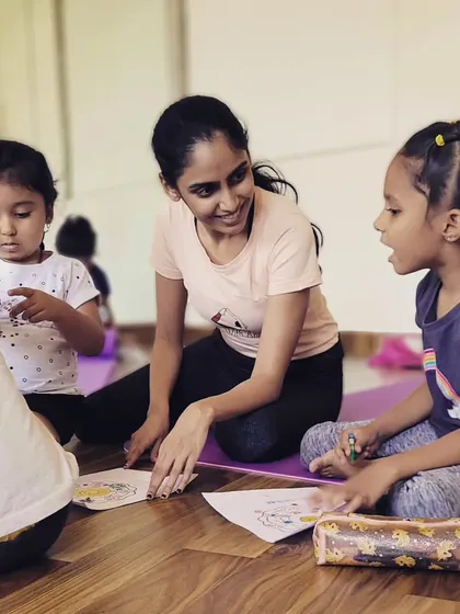 A special Mother's Day class where kids got to be creative after their practice. Here, I'm chatting with them as they color their mandala art.