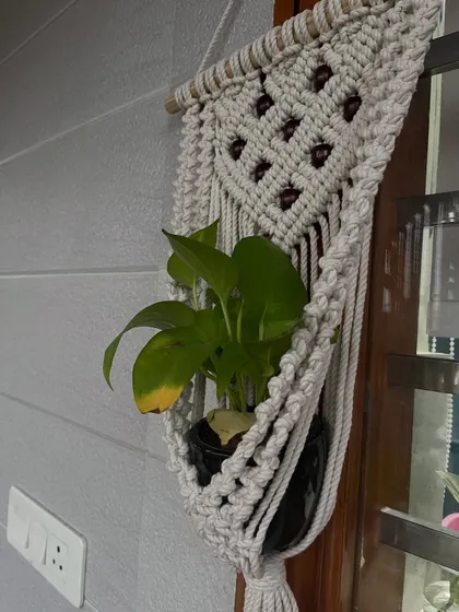 A customer's photo of my beaded plant hanger in their home. I love seeing how you style my creations. This one looks perfect by the window!