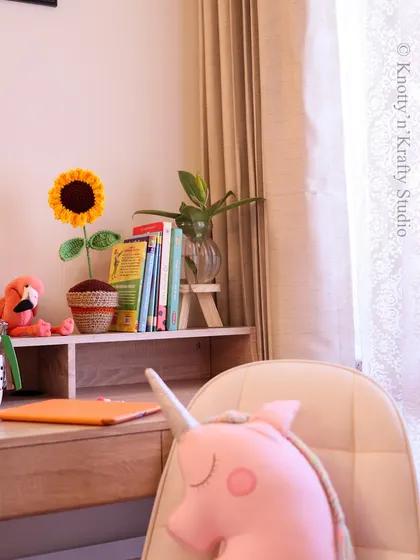 The sunflower desktop buddy, seen here in a child's study space. It’s a small touch that can make a big difference.