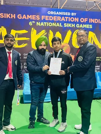 Presenting the certificate to one of my winners at the National Sikh Games. It's an honor to see my students succeed.