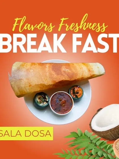 A closer look at our classic Masala Dosa. This crispy, golden-brown crepe is filled with a spiced potato mixture and served with fresh sambar and coconut chutney, a favorite at our HBR Layout restaurant.