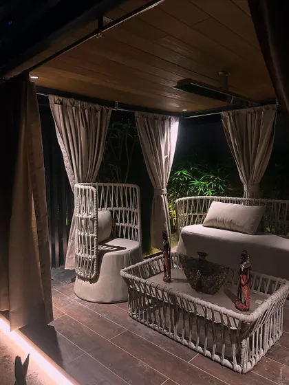 The pergola transforms into a magical space at night. Integrated lighting provides a warm, ambient glow, making it perfect for evening relaxation or entertaining.