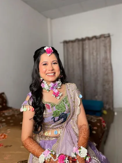 The joy on her face is unmistakable. It's a pleasure to create looks for such happy and vibrant celebrations.