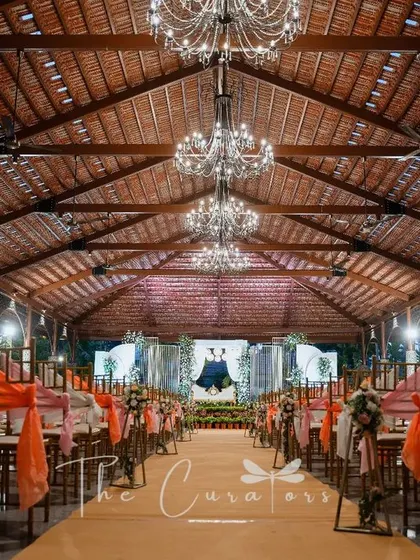 The warm lighting and elegant decor create a truly inviting and celebratory atmosphere for the wedding reception.