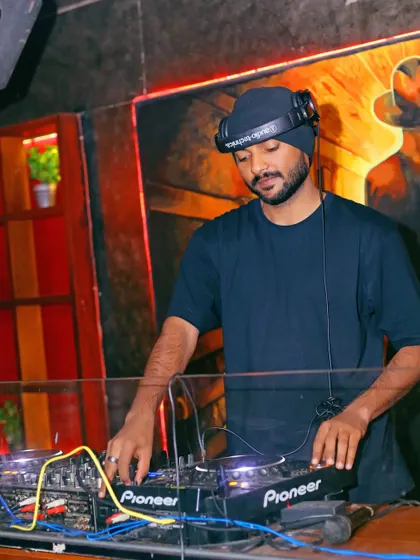 Focused on the details of the mix. Even the smallest adjustments can make a big difference in creating a great set, whether it's for a small gathering or a big club night.