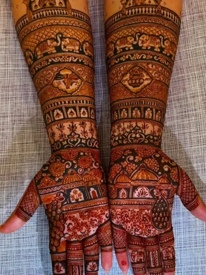 An extremely detailed and dense design covering the entire hands and forearms. This full-coverage style is perfect for the bride who wants a very traditional look.