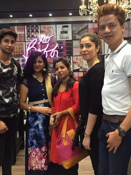 A group photo with my students during a shopping trip for makeup products. I guide them on how to build a professional kit.