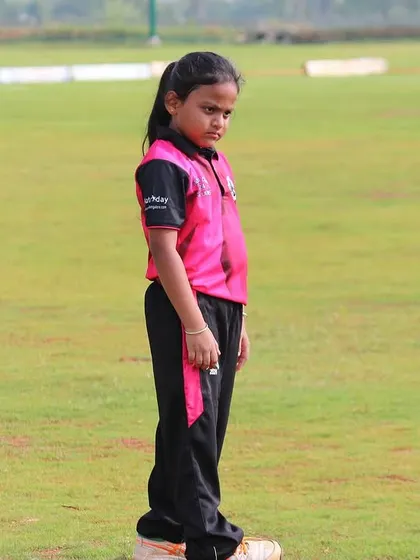 A young girl in her fielding position during a U-10 Dasara Cup match.