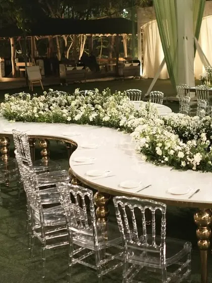 Another view of the unique, curved floral dining table.