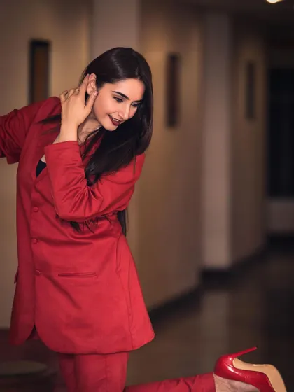 A powerful portrait of Ragini Dwivedi for her brand ambassadorship announcement. The red blazer and direct gaze convey confidence and professionalism, perfect for corporate and commercial campaigns.