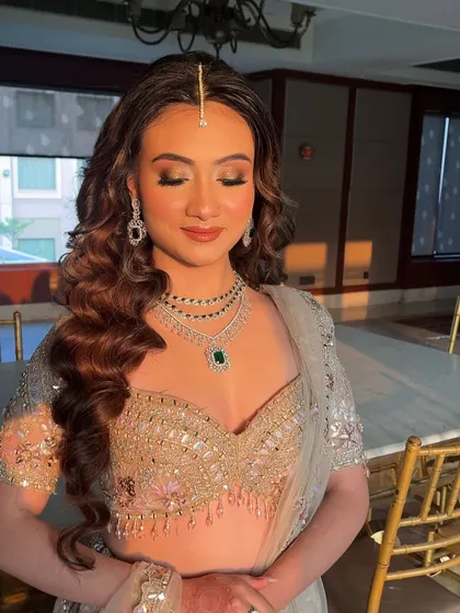 The perfect soft glam look captured in beautiful lighting. Notice how the highlighter catches the light on the high points of her face, creating a natural, lit from within radiance.