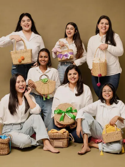 A fun team photo with some of our favorite sustainable packaging options. We are proud to support local artisans and promote eco-friendly gifting.