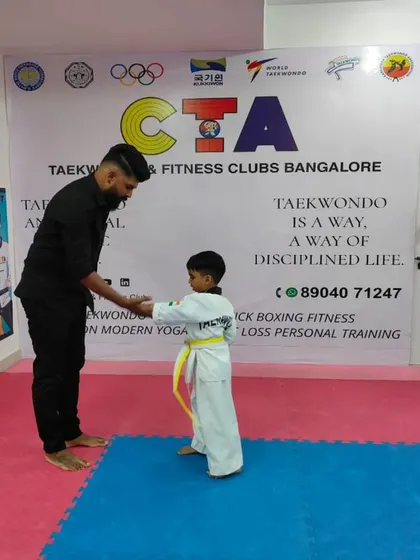 A handshake for a new yellow belt.