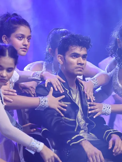 A dramatic moment from a previous musical production. We train our students in stage presence and character development to create compelling theater.