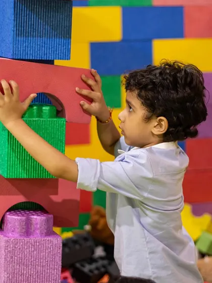 Building tall towers with our giant foam blocks is a favorite activity that encourages problem-solving and teamwork.