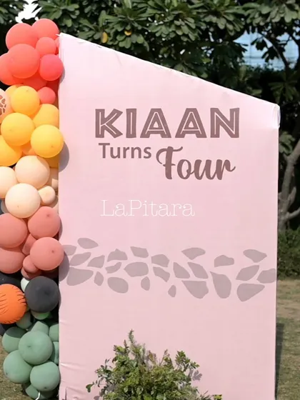 A personalized welcome board for Kiaan's fourth birthday, using a soft pink and earthy tones to complement the Lion King theme.