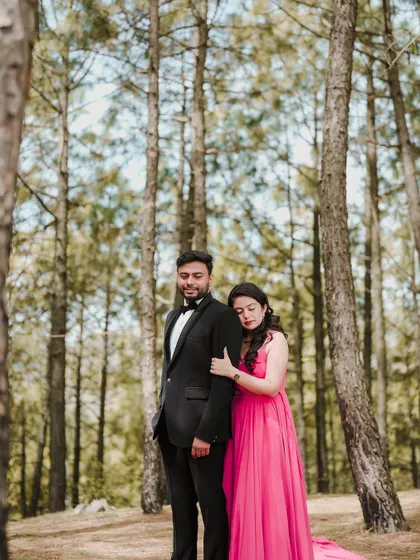 A quiet, tender moment between a couple during their pre-wedding shoot in a pine forest. This portrait focuses on their connection amidst the tranquility of nature.