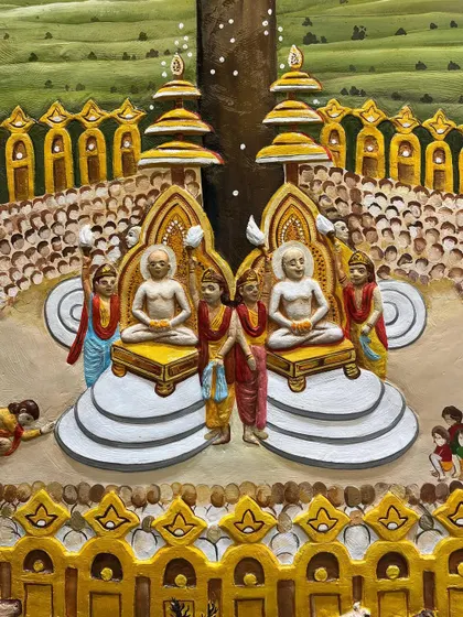 The central figures of the Samavasarana, seated on their thrones. The level of detail in this piece reflects the sacredness of the subject.