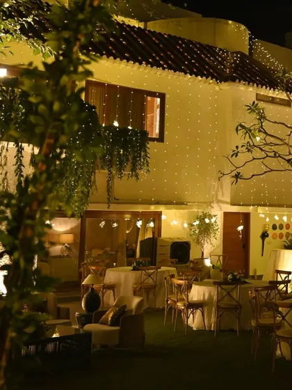 The house exterior, draped in curtains of warm fairy lights. This simple yet effective lighting design instantly transforms the space into a festive and magical wonderland.