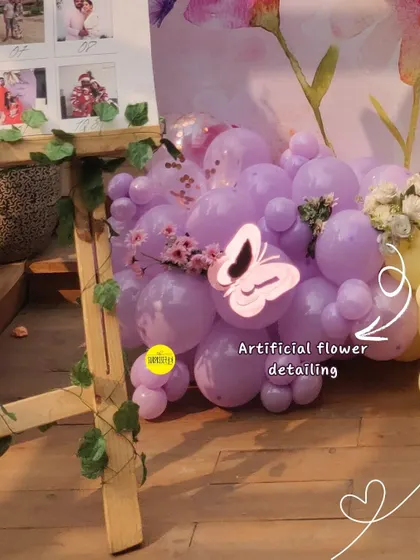 We even added artificial flower and butterfly details to the base of the photo easel, ensuring every corner of the celebration was filled with beauty.