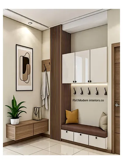 A clean and organized entryway with everything in its place. This design features a floating console, coat hooks, and a comfortable bench with storage drawers underneath.