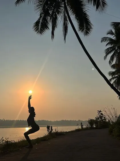 A playful silhouette in Utkatasana, or chair pose, as I "hold" the setting sun. My retreats are not just about serious practice, but also about finding joy and creativity in movement.