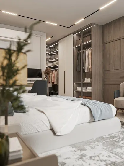 This view showcases the walk-in closet area integrated within the master bedroom, featuring open shelving and glass doors.