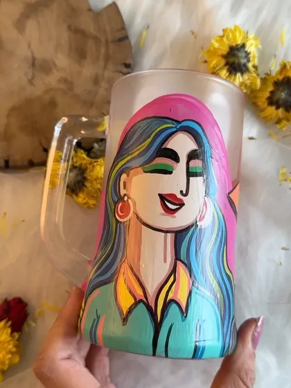 The same colorful beer mug, showing how the light catches the frosted glass.
