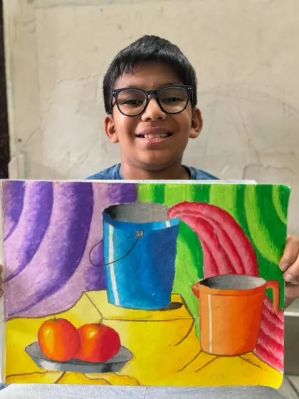 Still life drawing is a fundamental skill that I teach to help students understand form, shading, and composition. This colourful piece by a 6th-grade student shows a wonderful grasp of these core concepts.