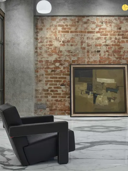 Another shot of the 'blank slate' at 'The Canvas.' An empty room with exposed brick and a lone armchair, waiting for the layers of design to be added.