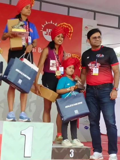 Victory is sweet. Standing on the podium at the Satara Hill Marathon with my daughter. I secured first in my age category and third overall.
