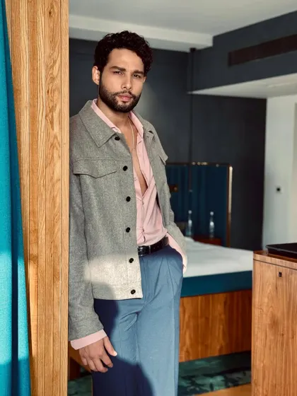 For this look on Siddhant Chaturvedi, I played with a soft color palette. The grey jacket over a blush pink shirt and blue trousers is an unexpected but stylish combination for a press event.