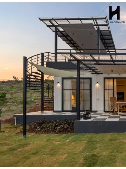 This French-themed prefab villa showcases our ability to execute specific aesthetic visions. Featuring a rooftop deck with a spiral staircase and a distinctive checkered patio, it’s a testament to our custom design capabilities and attention to detail.