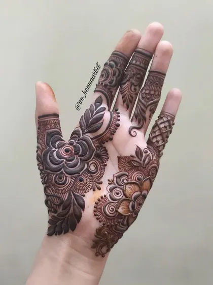 The start of a beautiful floral design. This shows the main flower motif on the palm before the rest of the pattern is added.