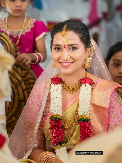 A candid moment from a wedding ceremony. This bride's natural, glowing makeup ensures she looks fresh and beautiful throughout the day, even in unposed shots.