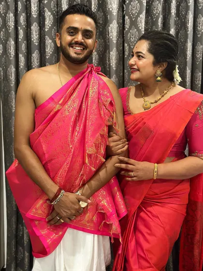 A candid moment between the couple, showcasing how comfortable and happy they feel in their coordinated traditional attire.