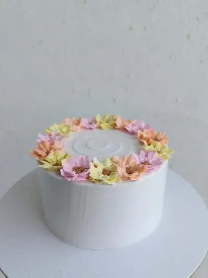 The simple elegance of this floral wreath cake makes it perfect for any occasion.